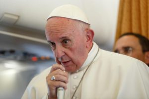 Pope Francis answers questions from journalists aboard his flight from Malmo, Sweden, to Rome Nov. 1. (CNS photo/Paul Haring) See POPE-SWEDEN-PLANE Nov. 1, 2016.
