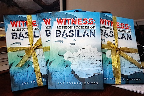 Copies of ‘Witness: Mission Stories of Basilan’, edited by Joe Torres (Credit: ucanews.com)