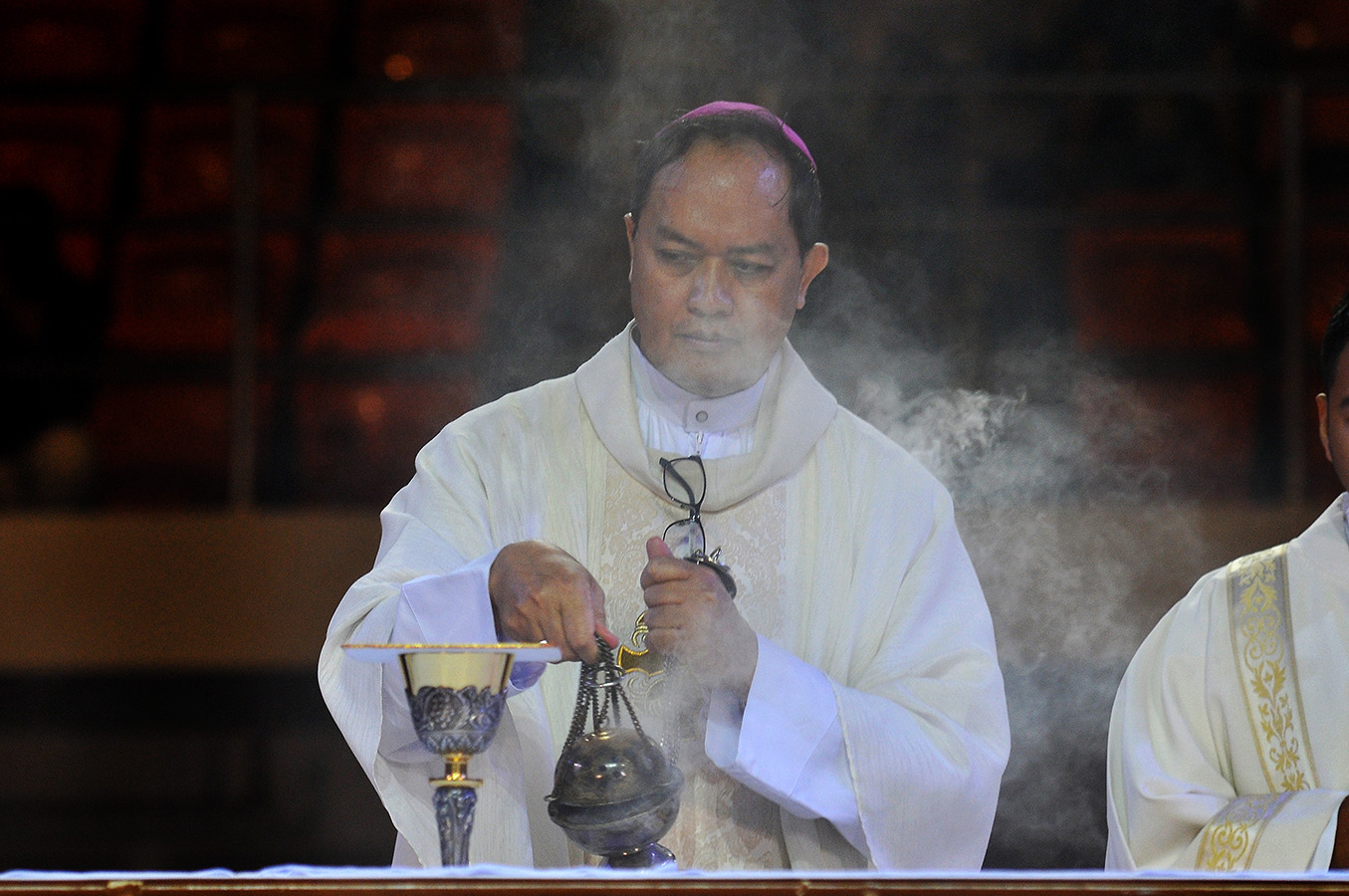 Bishop Pablo Virgilio David of Kalookan celebrates Mass at the Philippine Conference on New Evangelization at the University of Sto. Tomas in Manila, July 19, 2018. ROY LAGARDE